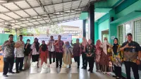 2.081 KPM  Kelurahan Cipayung Terima Bantuan Beras Masing-masing 30 Kg